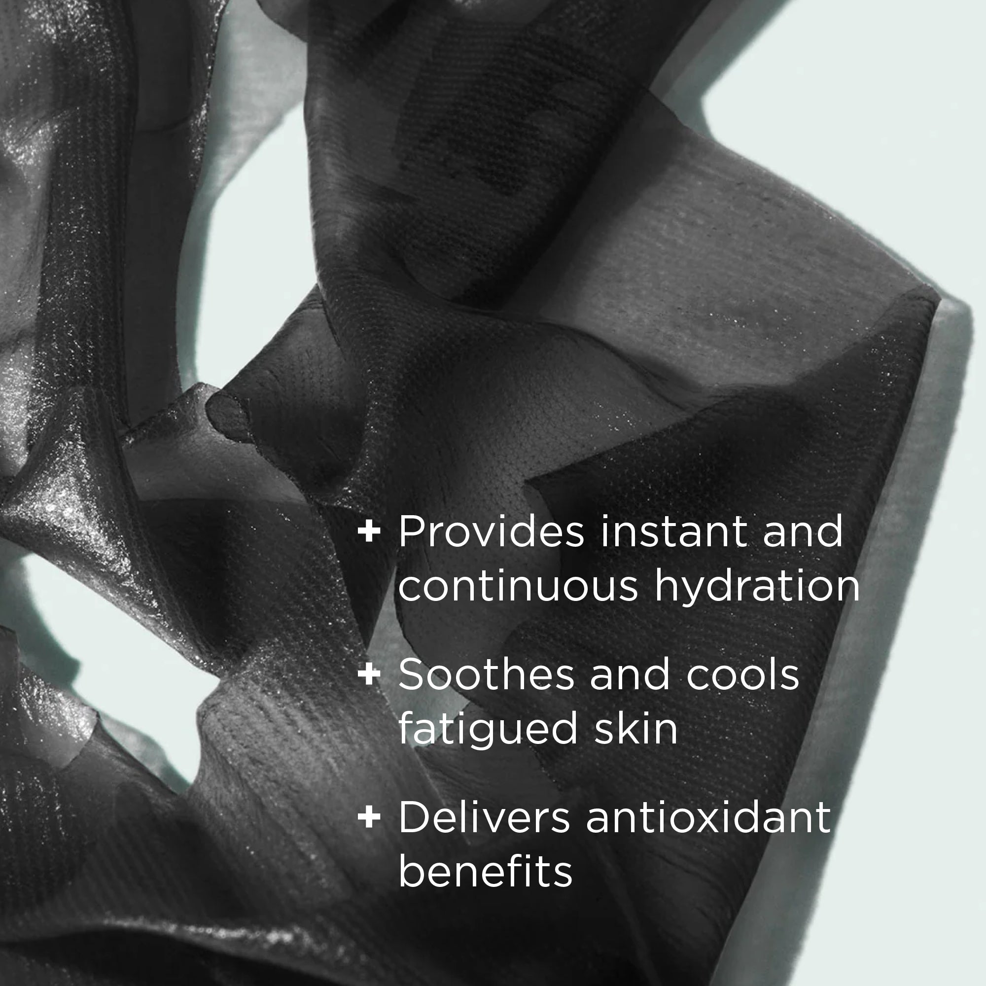 black sheet mask on light background with benefits callouts